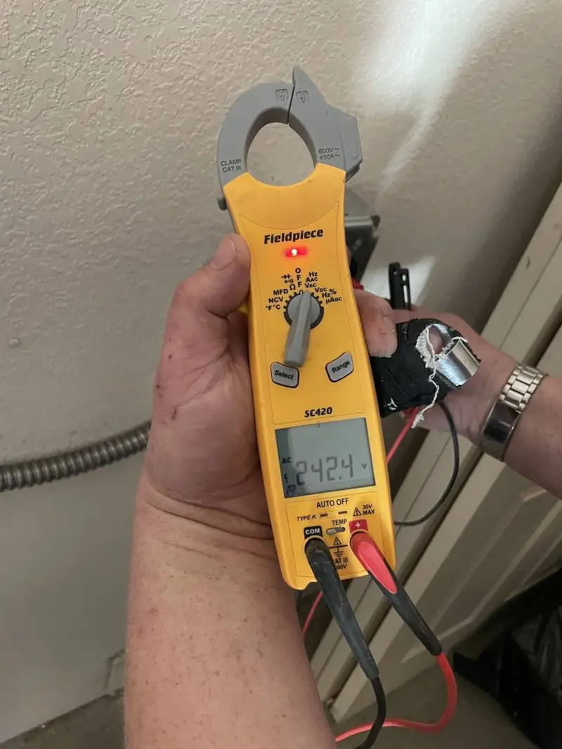 Voltage testing with clamp meter during Hot Tub / Pool Electrical Wiring in Norwood